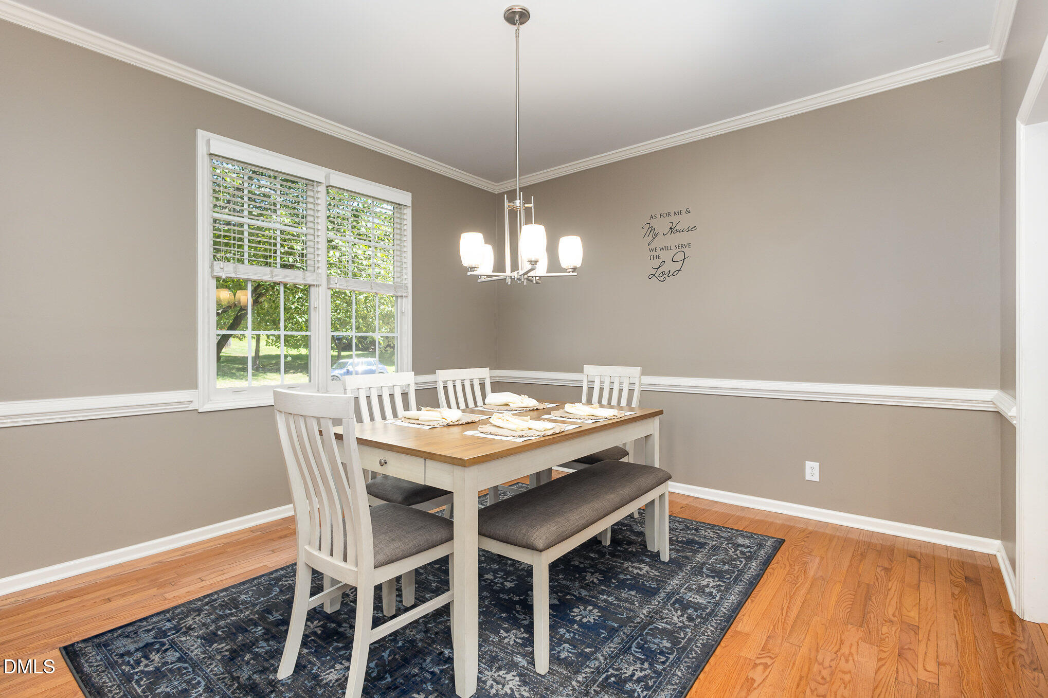 1004 Chancellors Ridge Drive Durham, NC 27713 - Photo 10 of 32 a view of a dining room with furniture window and wooden floor