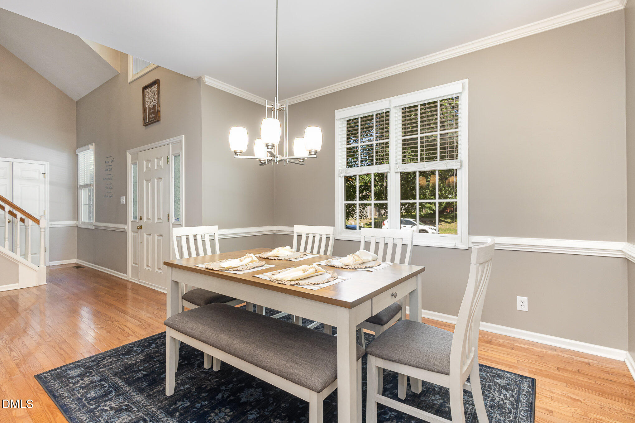 1004 Chancellors Ridge Drive Durham, NC 27713 - Photo 11 of 32 a view of a dining room with furniture window and wooden floor