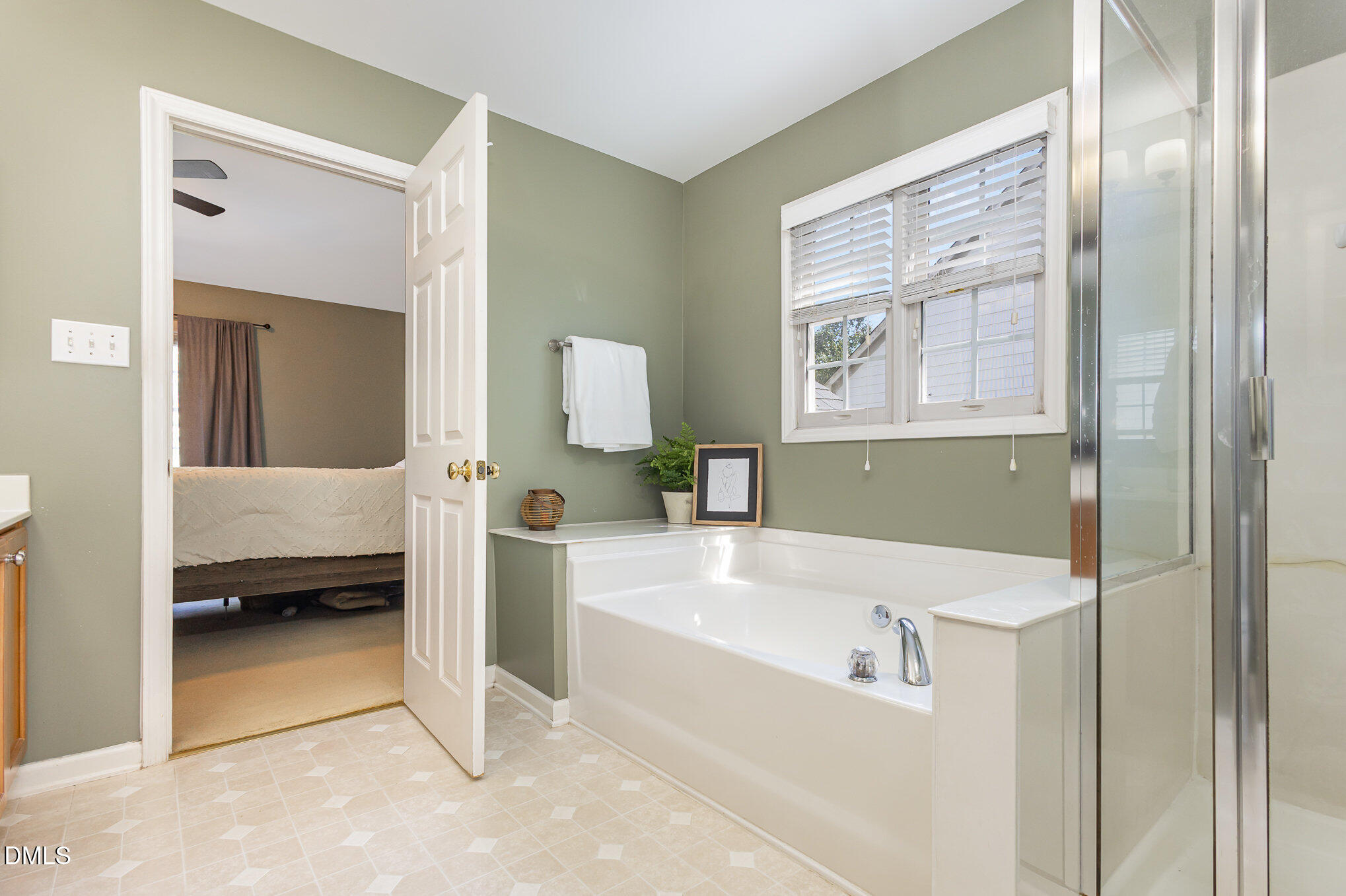 1004 Chancellors Ridge Drive Durham, NC 27713 - Photo 15 of 32 a en suite bathroom with a tub sink and view bedroom