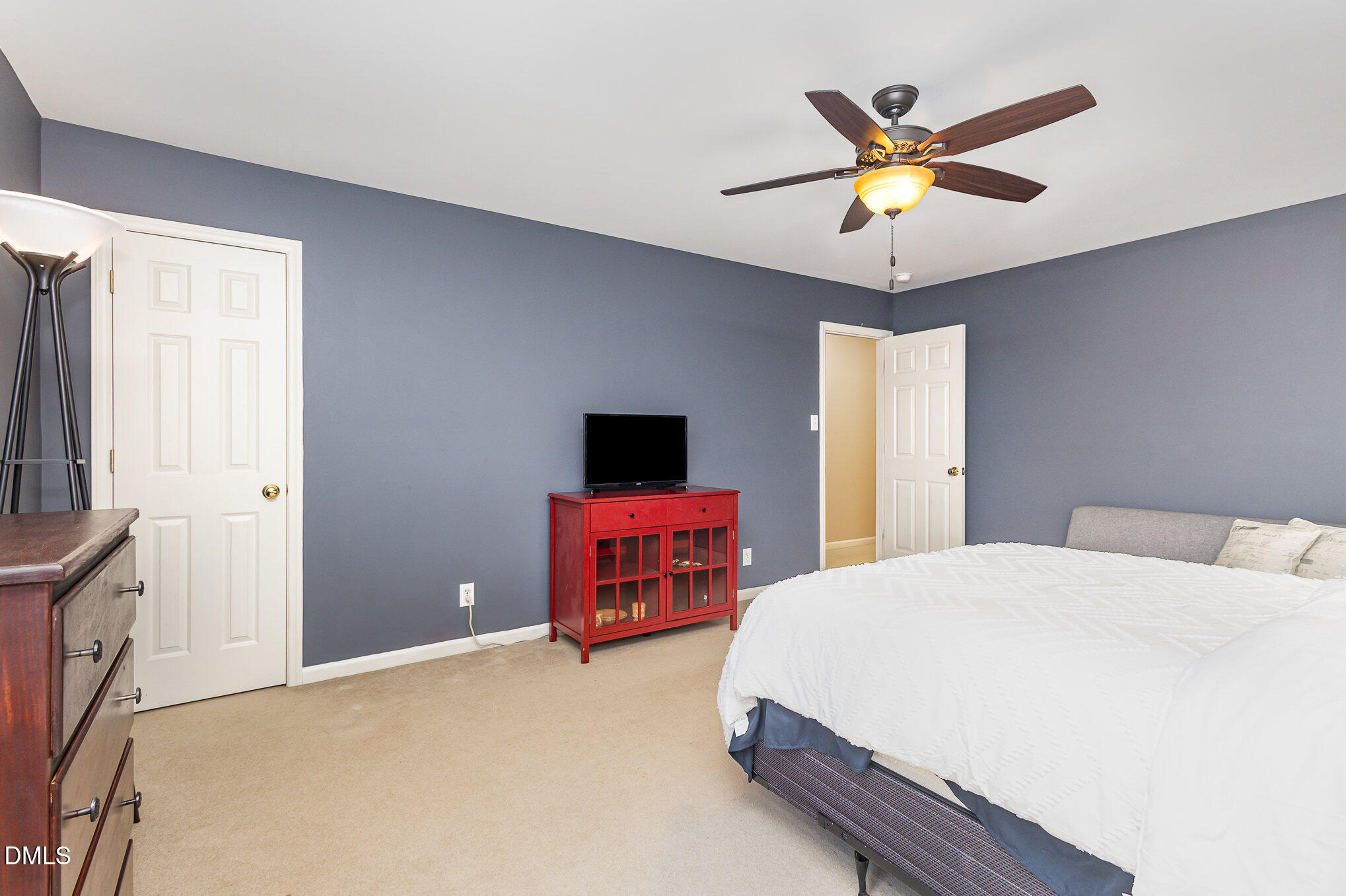 1004 Chancellors Ridge Drive Durham, NC 27713 - Photo 17 of 32 a bedroom with a bed and a flat screen tv