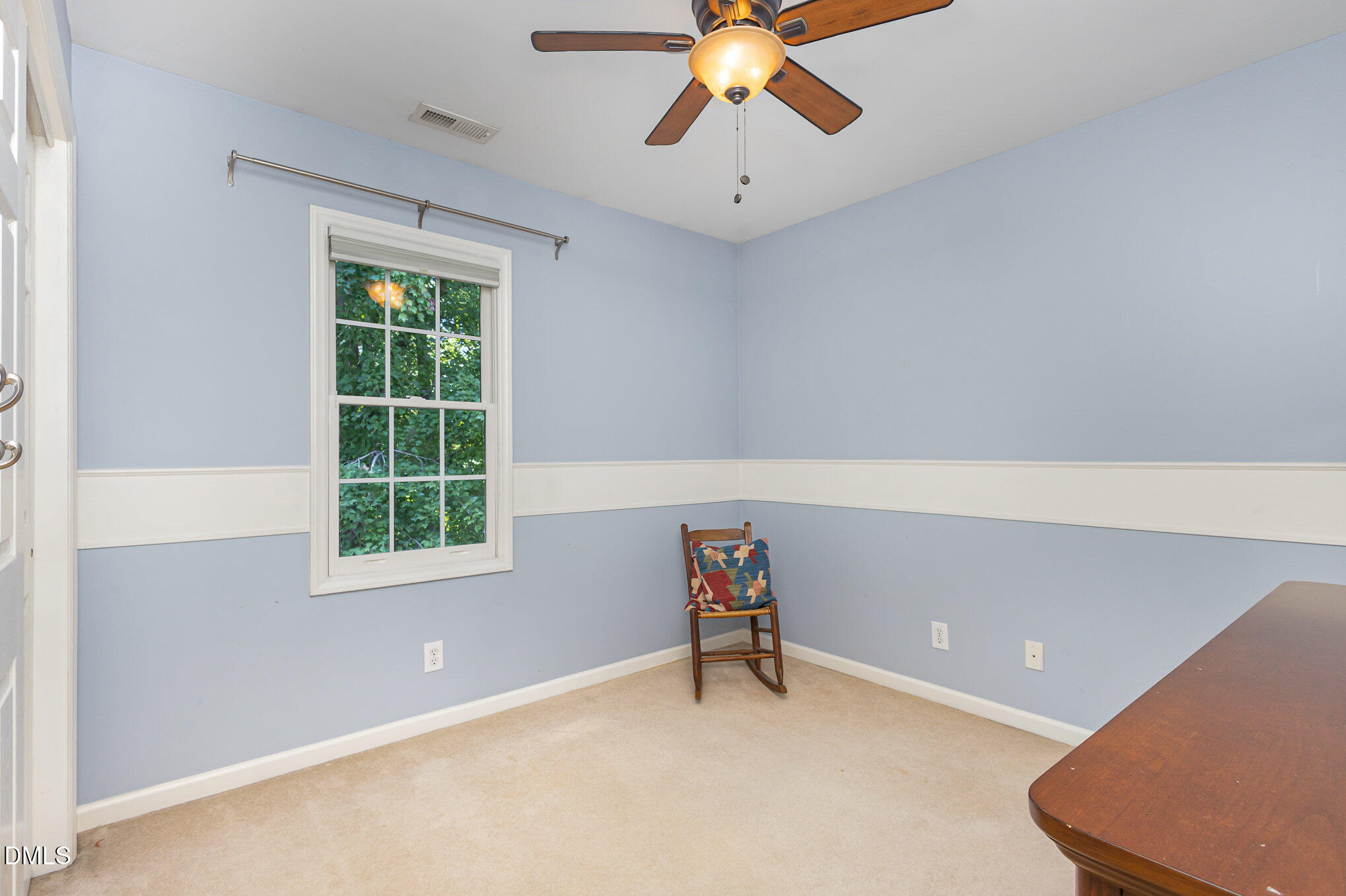 1004 Chancellors Ridge Drive Durham, NC 27713 - Photo 19 of 32 an empty room with windows and ceiling fan