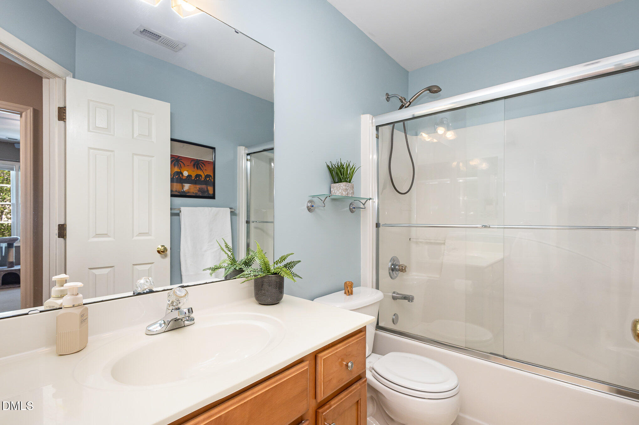 1004 Chancellors Ridge Drive Durham, NC 27713 - Photo 21 of 32 a bathroom with a sink a toilet and shower