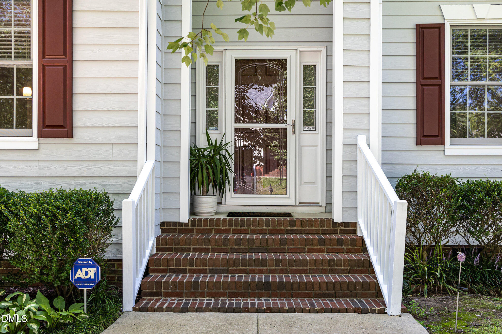 1004 Chancellors Ridge Drive Durham, NC 27713 - Photo 25 of 32 a front view of a house with a garden