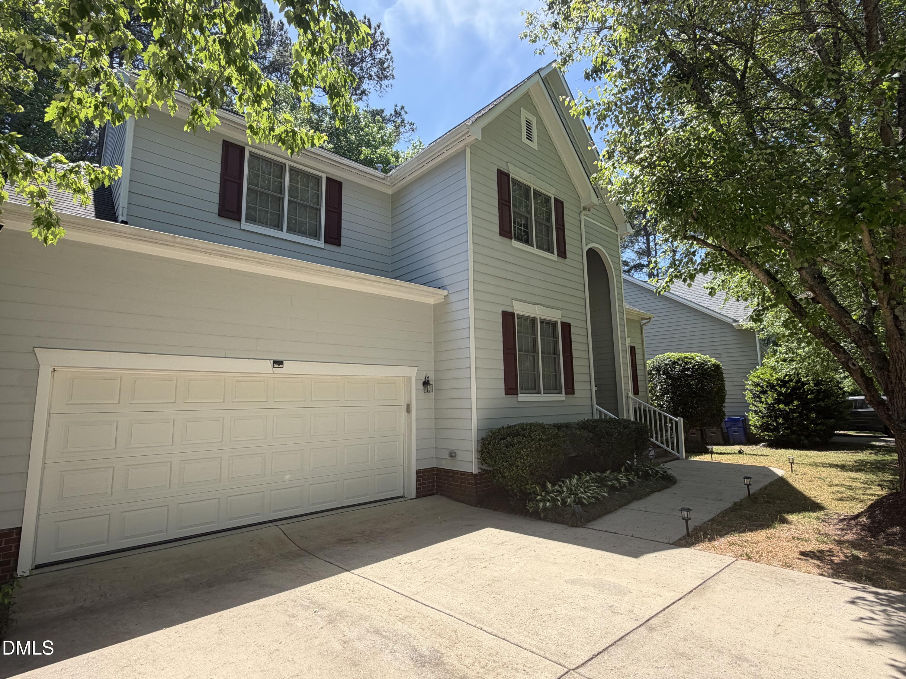 1004 Chancellors Ridge Drive Durham, NC 27713 - Photo 2 of 32 a view of a house with backyard and trees