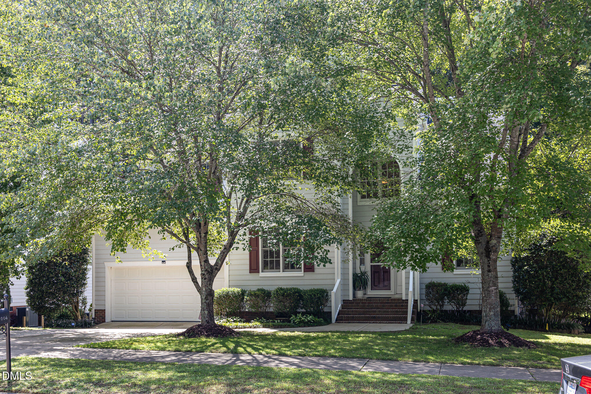 1004 Chancellors Ridge Drive Durham, NC 27713 - Photo 30 of 32 a front view of a house with garden