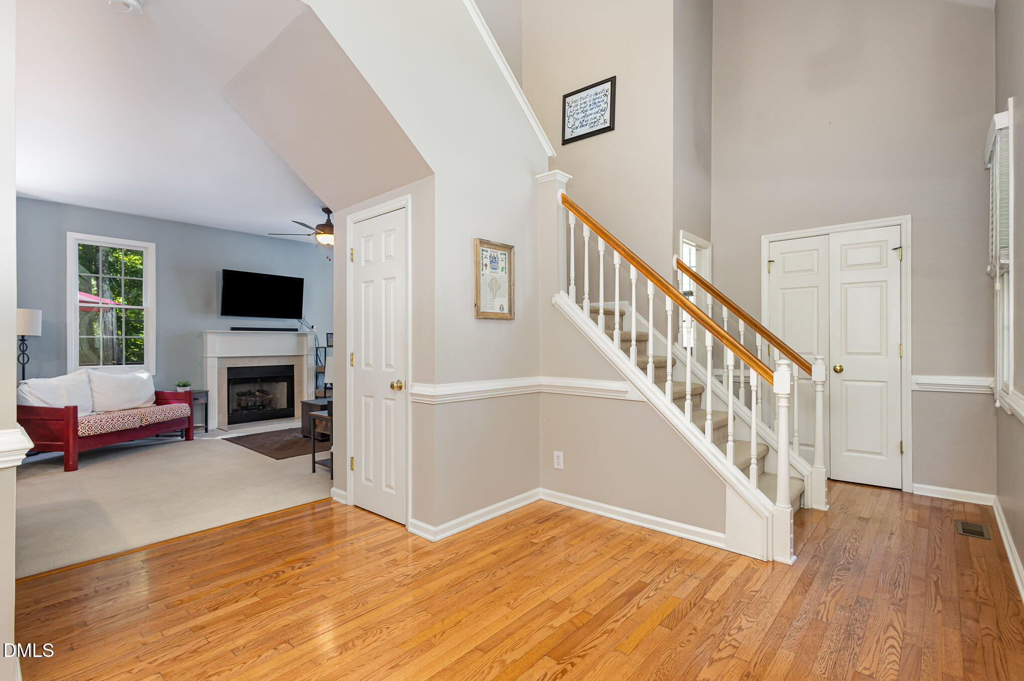 1004 Chancellors Ridge Drive Durham, NC 27713 - Photo 8 of 32 a view of livingroom with hardwood floor and a fireplace