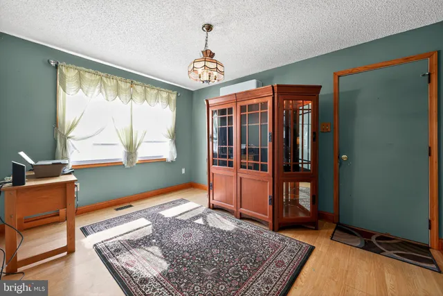 a living room with a large bed and a window