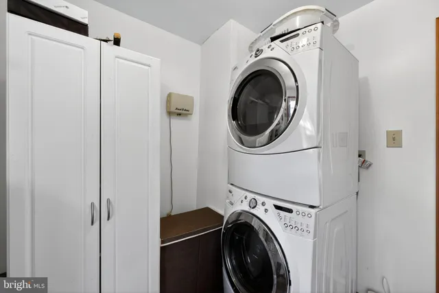 a view of a hallway with washer and dryer
