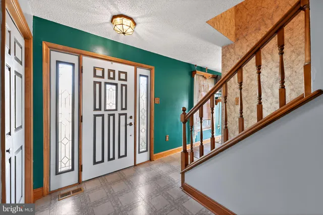 a view of an entryway with staircase