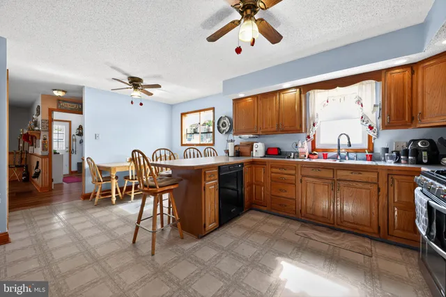 a kitchen with cabinets a sink and appliances