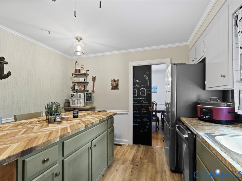 222 Homestead Drive Colonial Heights, VA 23834 - Photo 12 of 35 a kitchen with a sink stove and refrigerator