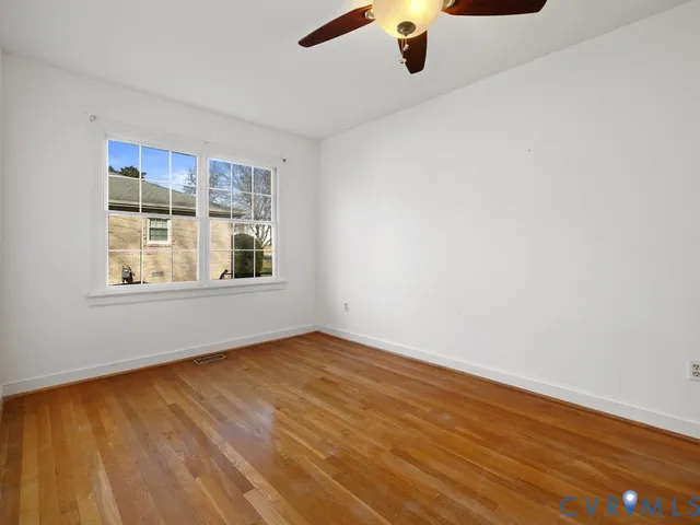 a house view with a sitting space and garden