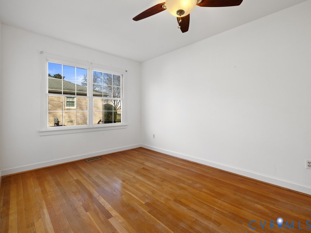 222 Homestead Drive Colonial Heights, VA 23834 - Photo 16 of 35 wooden floor in an empty room with a window