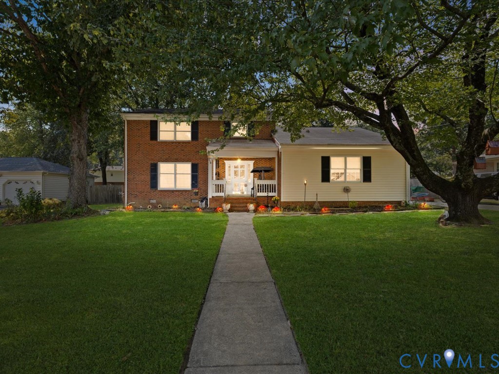 222 Homestead Drive Colonial Heights, VA 23834 - Photo 2 of 35 a front view of a house with a yard and potted plants