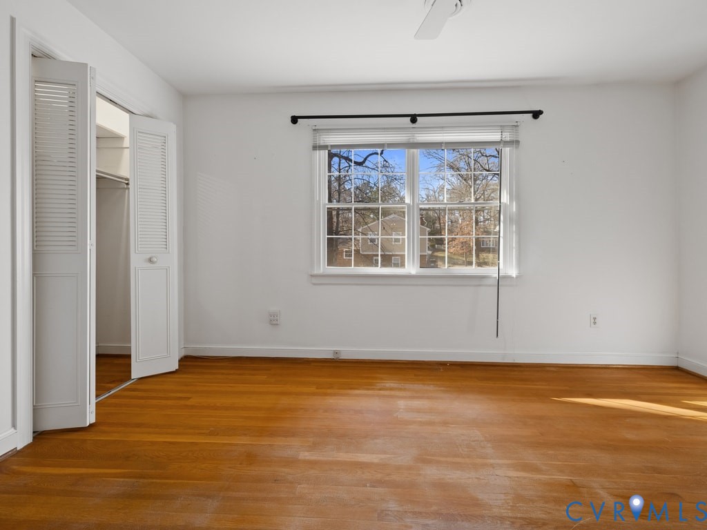 222 Homestead Drive Colonial Heights, VA 23834 - Photo 24 of 35 a view of an empty room with wooden floor and a window