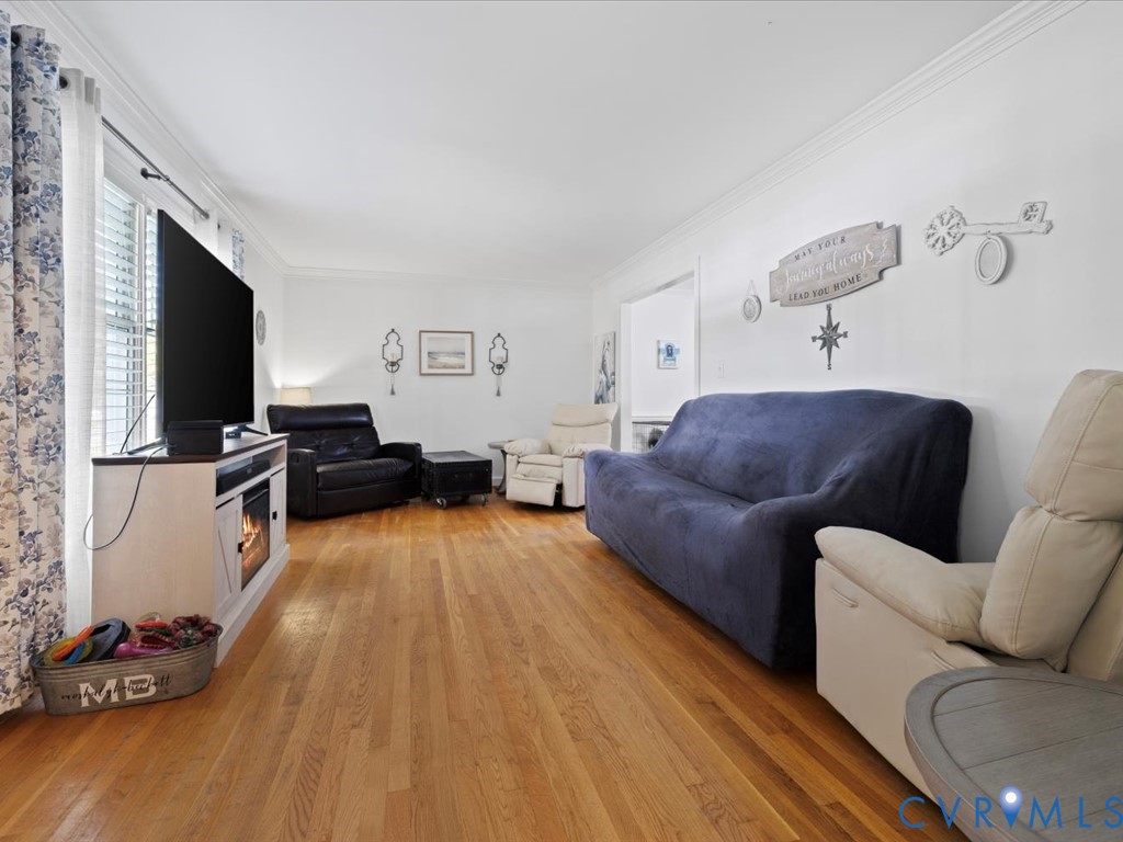 222 Homestead Drive Colonial Heights, VA 23834 - Photo 6 of 35 a living room with furniture and a flat screen tv
