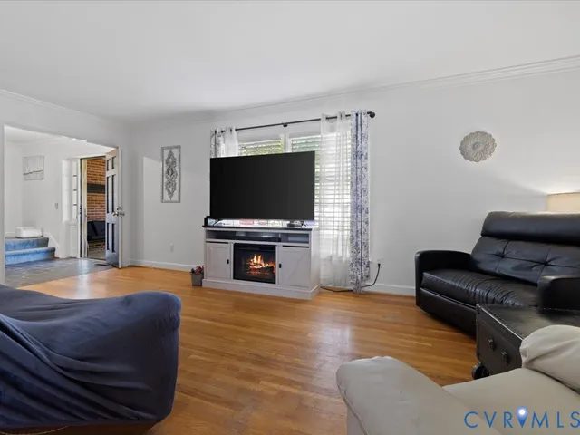 a view of a livingroom with furniture and a window