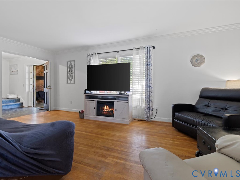 222 Homestead Drive Colonial Heights, VA 23834 - Photo 8 of 35 a living room with furniture and a flat screen tv