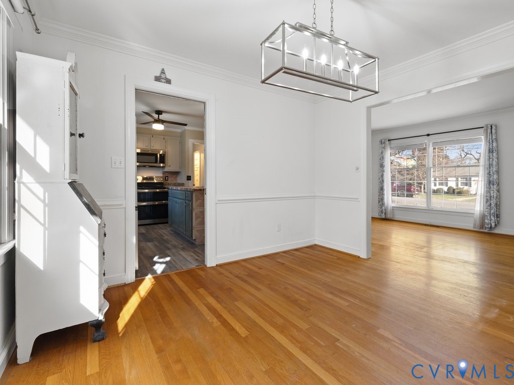 222 Homestead Drive Colonial Heights, VA 23834 - Photo 9 of 35 a bedroom with a bed and wooden floor