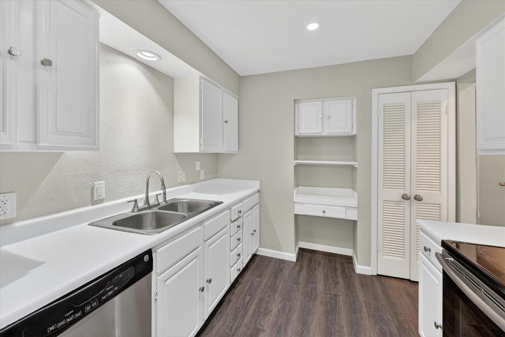 9809 Matchpoint Place Dallas, TX 75243 - Photo 6 of 21 Kitchen featuring white cabinetry, white countertops, a stainless steel double basin sink, recessed lighting, and wood-finish flooring