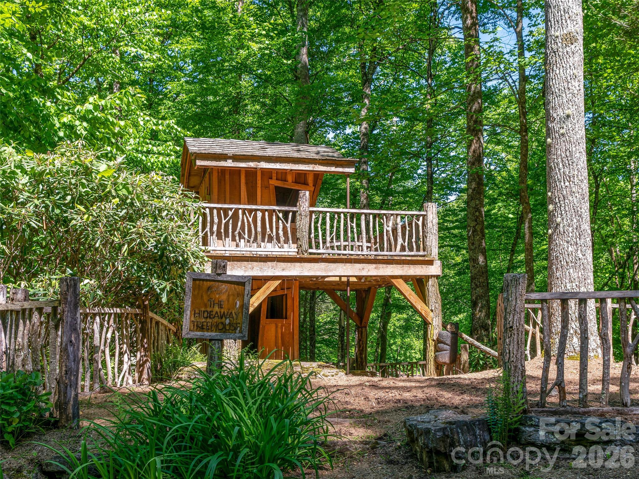 42 Hickory Springs Road, Unit 42 Burnsville, NC 28714 - Photo 28 of 35 a front view of a house with garden
