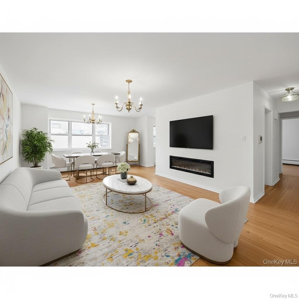 99-10 60th Avenue, Unit 5D Queens, NY 11368 - Photo 2 of 9 a living room with furniture and a flat screen tv