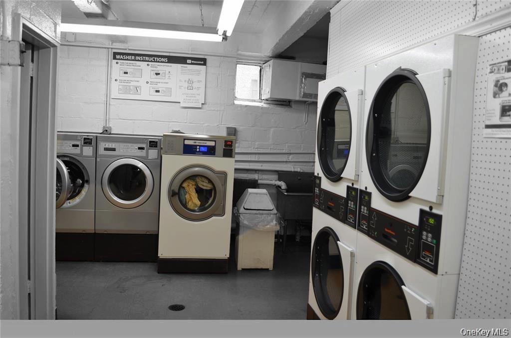 99-10 60th Avenue, Unit 5D Queens, NY 11368 - Photo 6 of 9 a utility room with dryer and washer