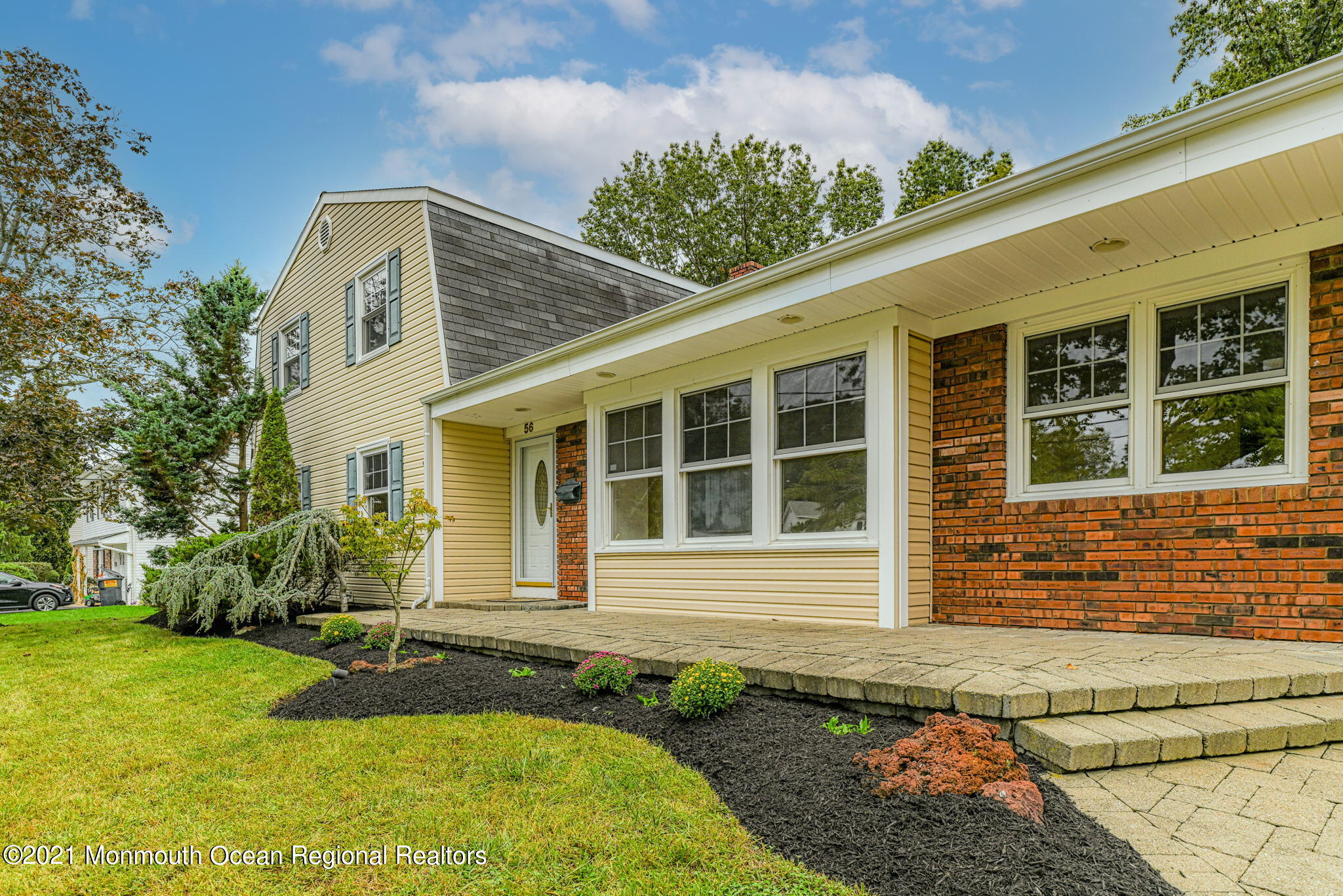 56 Newbury Road Howell, NJ 07731 - Photo 2 of 32 a front view of a house with garden