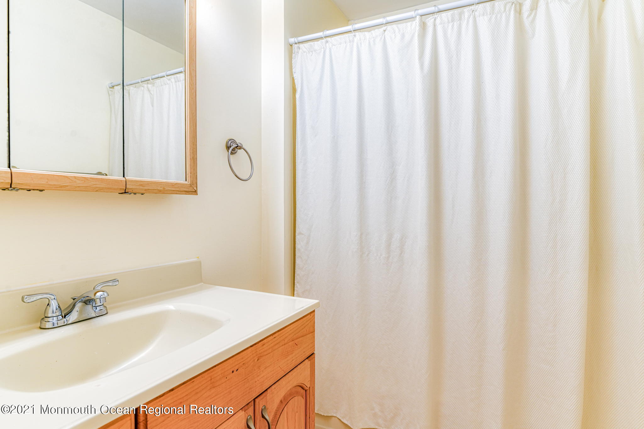 56 Newbury Road Howell, NJ 07731 - Photo 18 of 32 a bathroom with a sink and a mirror