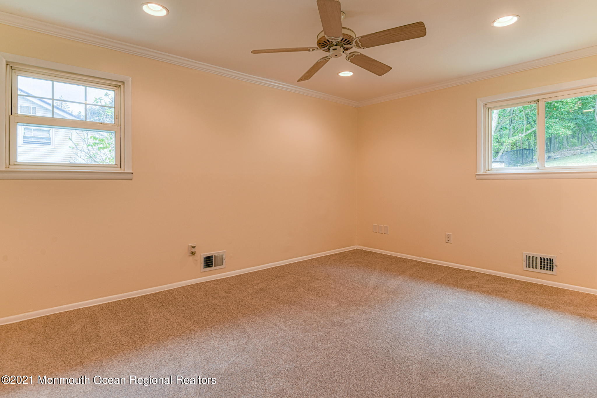56 Newbury Road Howell, NJ 07731 - Photo 22 of 32 an empty room with a window and a fan