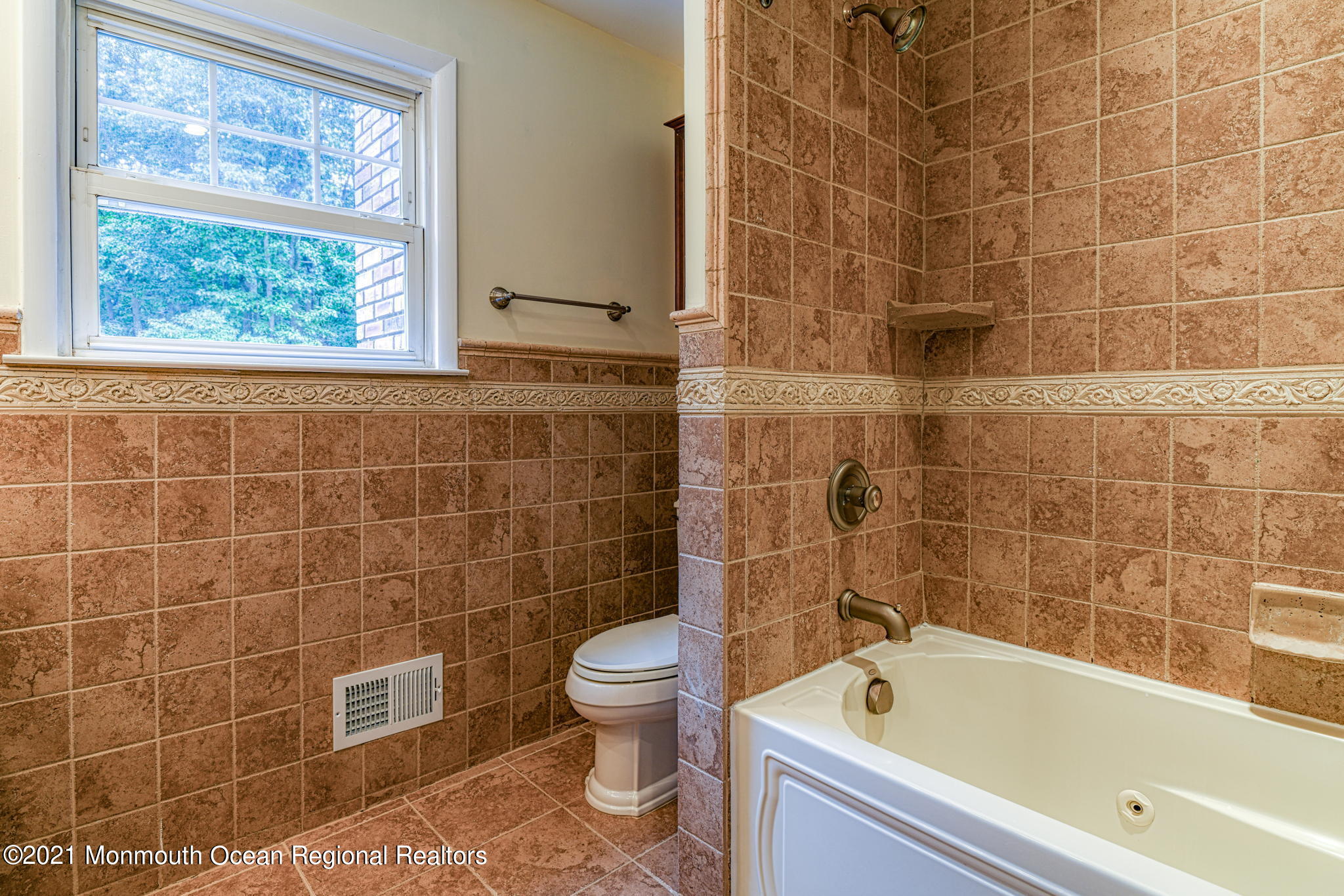 56 Newbury Road Howell, NJ 07731 - Photo 23 of 32 a bathroom with a bathtub and a toilet