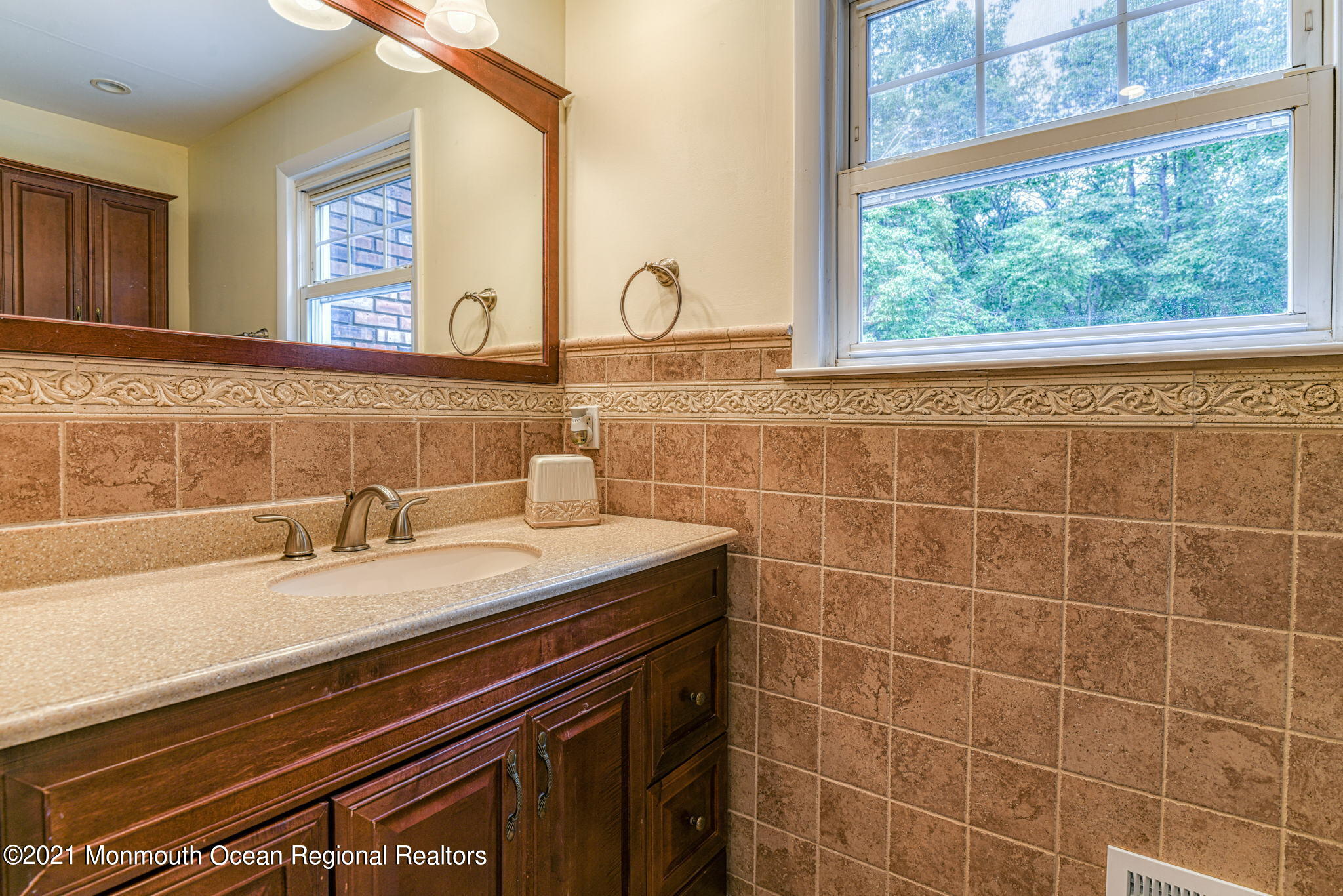 56 Newbury Road Howell, NJ 07731 - Photo 24 of 32 a bathroom with a sink and a mirror