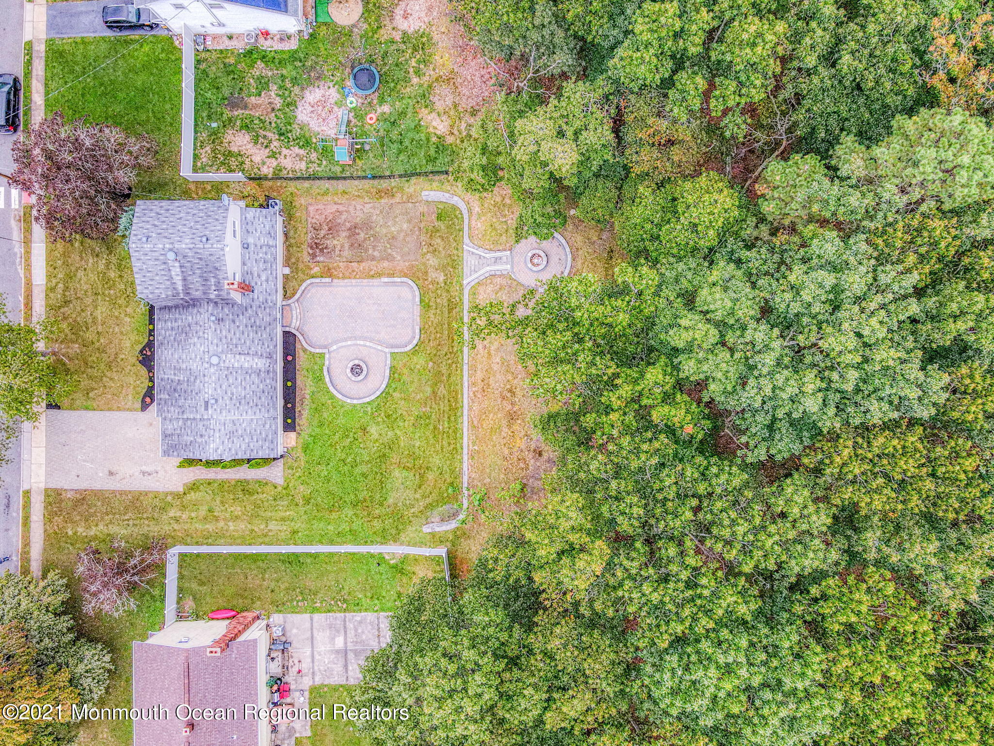 56 Newbury Road Howell, NJ 07731 - Photo 31 of 32 an aerial view of a house with a yard and tennis court
