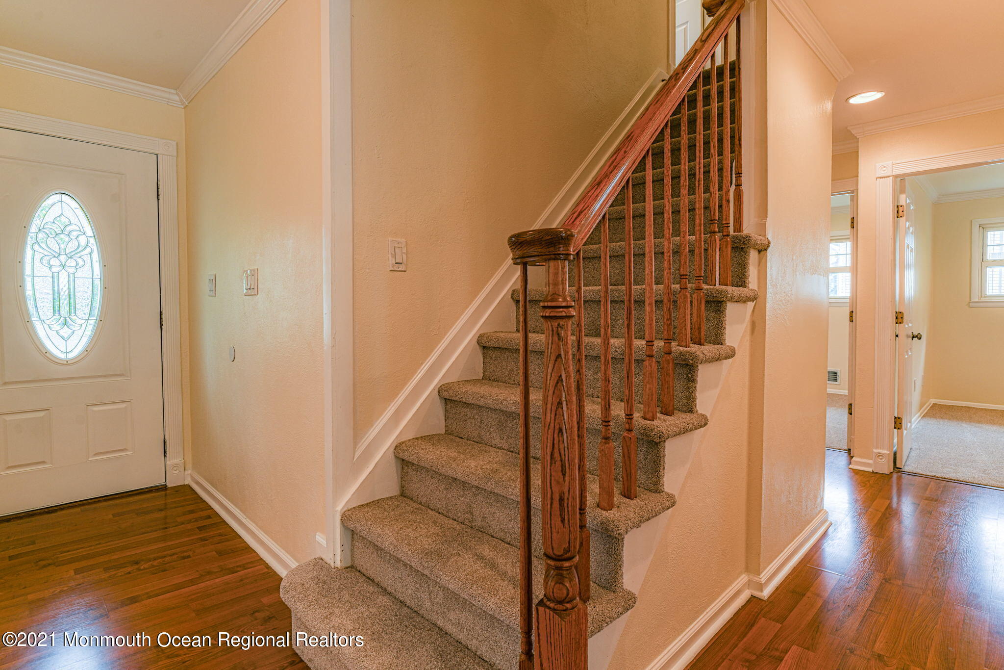 56 Newbury Road Howell, NJ 07731 - Photo 7 of 32 a view of a hallway with wooden floor and staircase