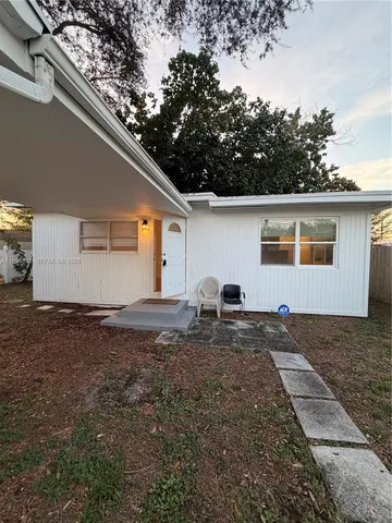 a house view with a backyard space