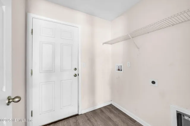 an empty room with wooden floor