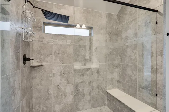 a bathroom with a sink double vanity and a mirror