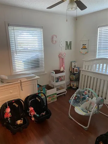 a room with furniture toys and a window