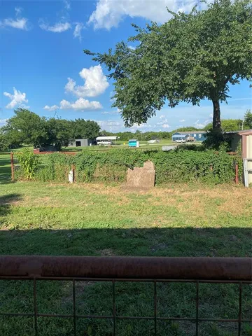 a view of a lake with a big yard