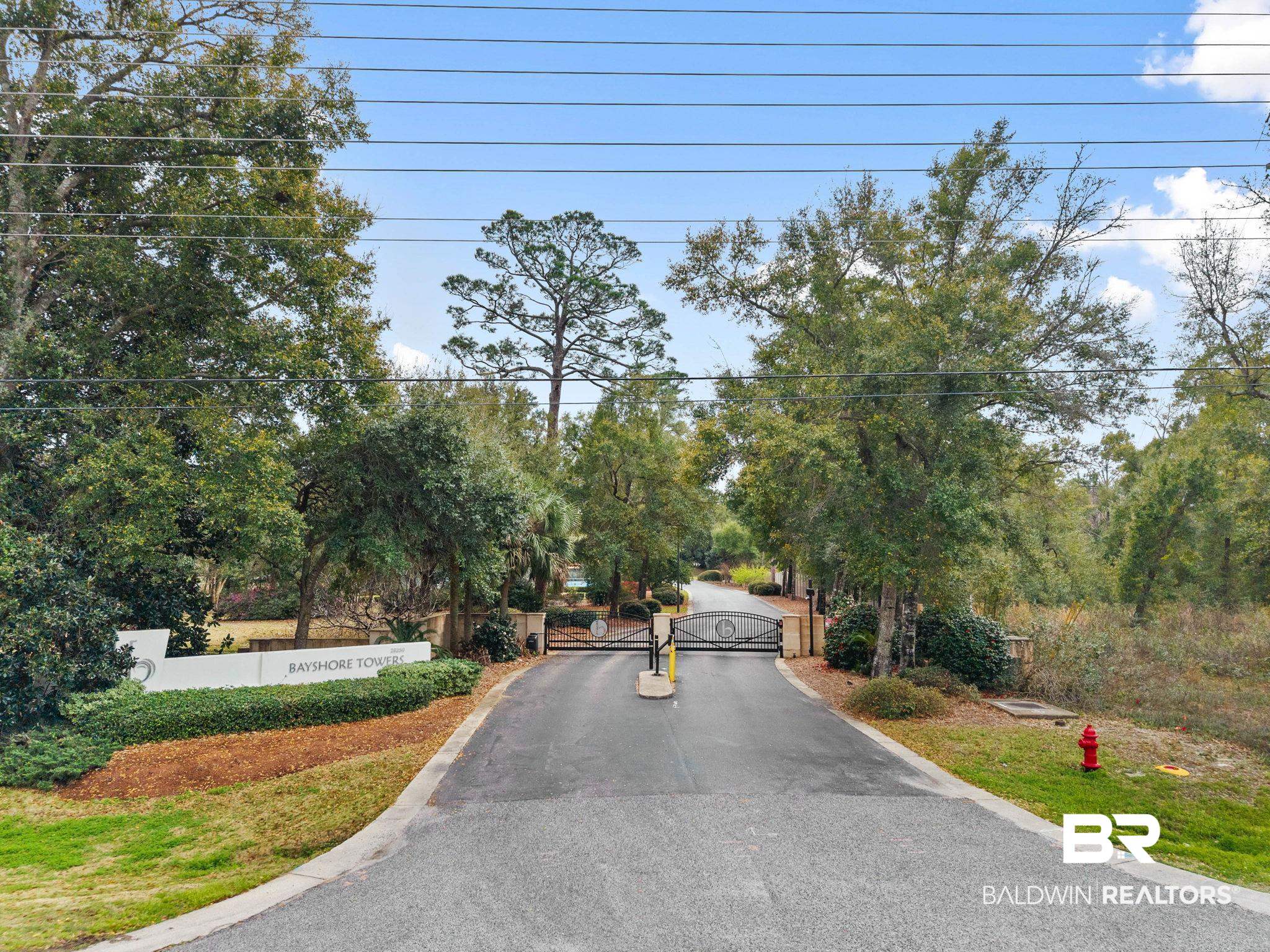 28250 Canal Road, Unit 208 Orange Beach, AL 36561 - Photo 53 of 53 View of asphalt street with a gated entry and a gate
