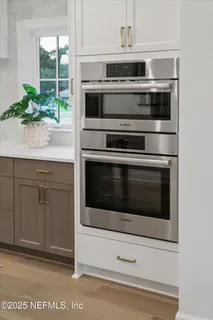 a kitchen with a stove and oven