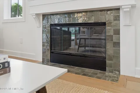 a bedroom with furniture and a large window