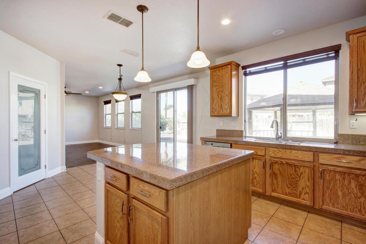 9987 Spring View Way Elk Grove, CA 95757 - Photo 13 of 28 a kitchen with granite countertop a sink and cabinets