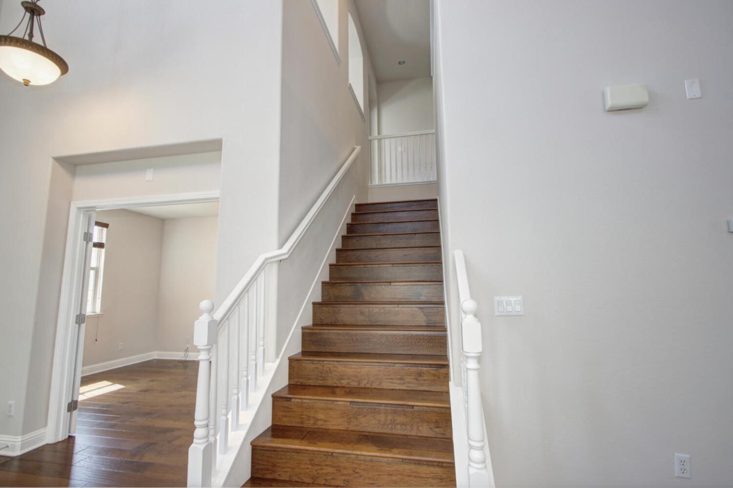 9987 Spring View Way Elk Grove, CA 95757 - Photo 14 of 28 a view of a hallway with wooden floor and entryway