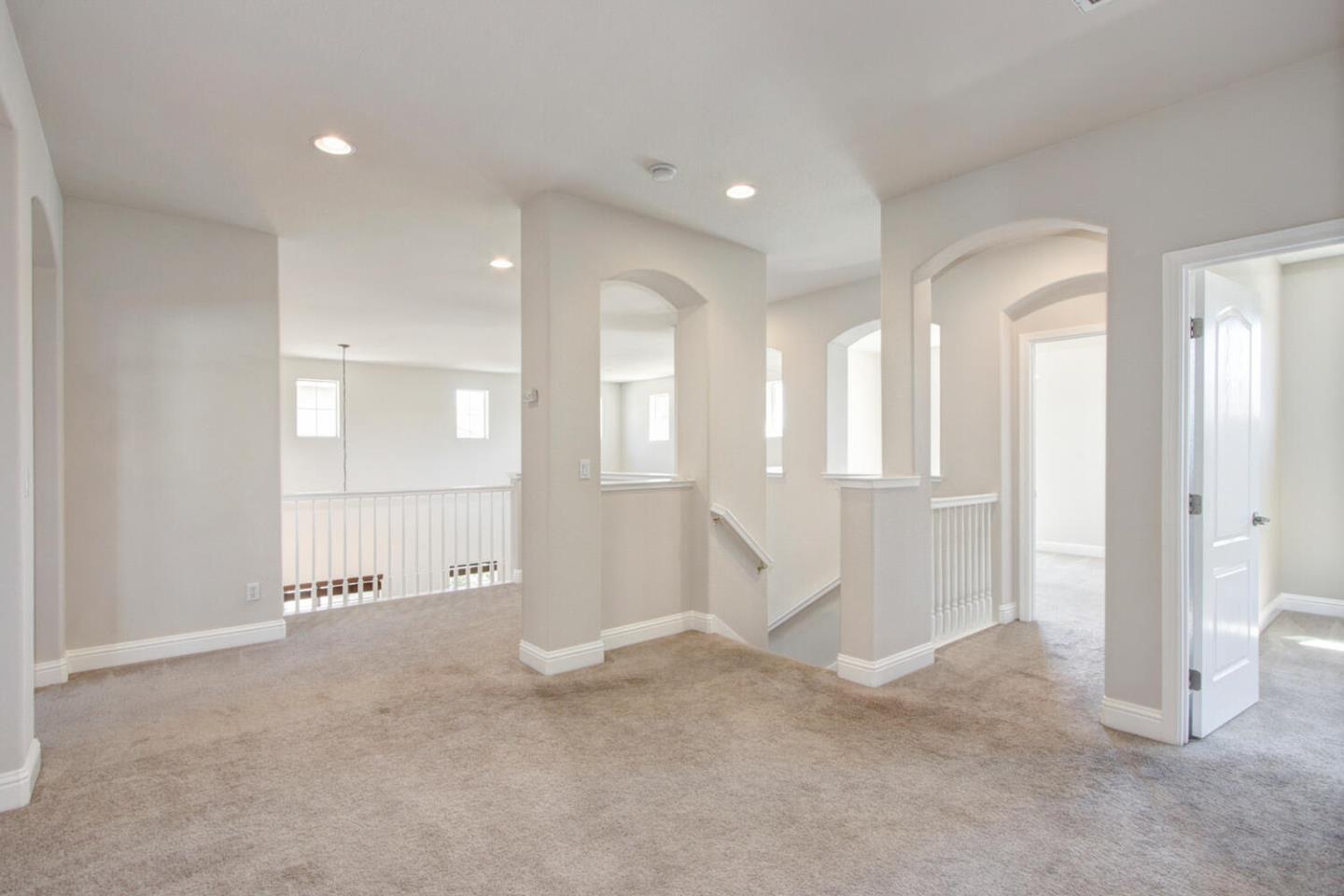 9987 Spring View Way Elk Grove, CA 95757 - Photo 16 of 28 a view of a big room with windows and pillars in it