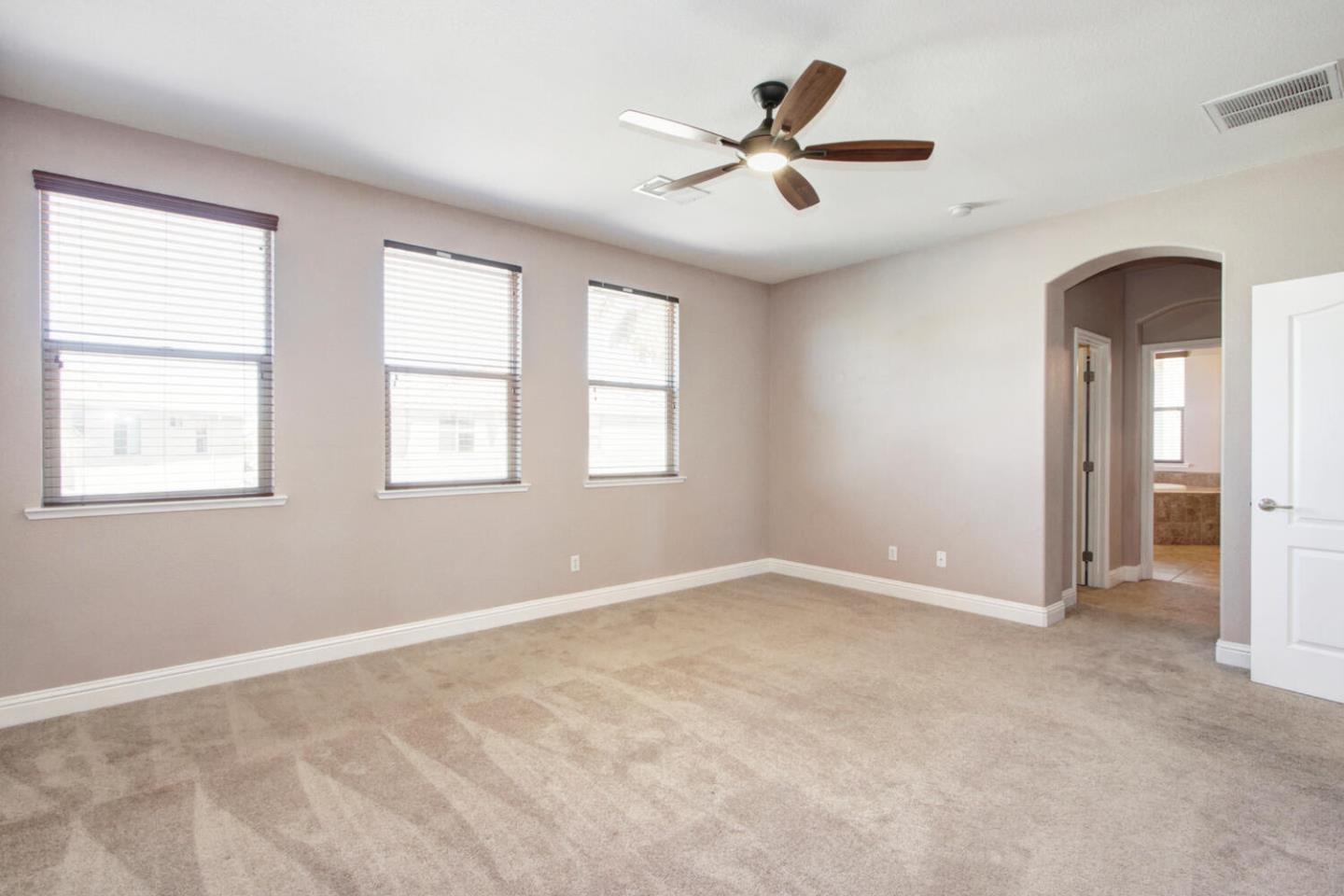 9987 Spring View Way Elk Grove, CA 95757 - Photo 17 of 28 a view of a livingroom with a ceiling fan and window