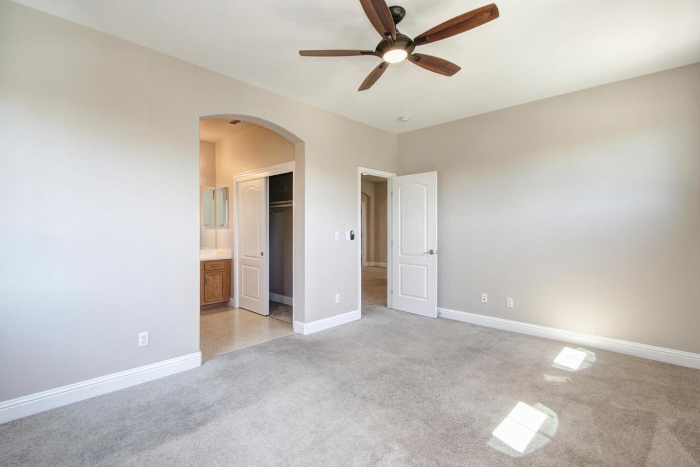 9987 Spring View Way Elk Grove, CA 95757 - Photo 22 of 28 a view of empty room with a ceiling fan