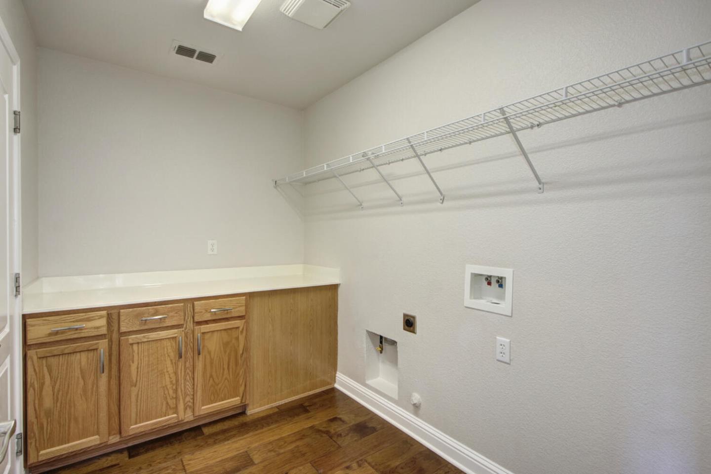 9987 Spring View Way Elk Grove, CA 95757 - Photo 26 of 28 a view of a storage & utility room with wooden floor