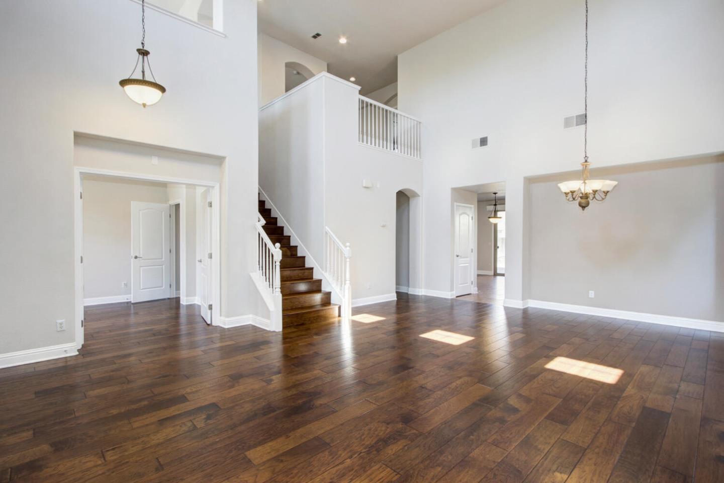 9987 Spring View Way Elk Grove, CA 95757 - Photo 6 of 28 a view of a hallway with wooden floor
