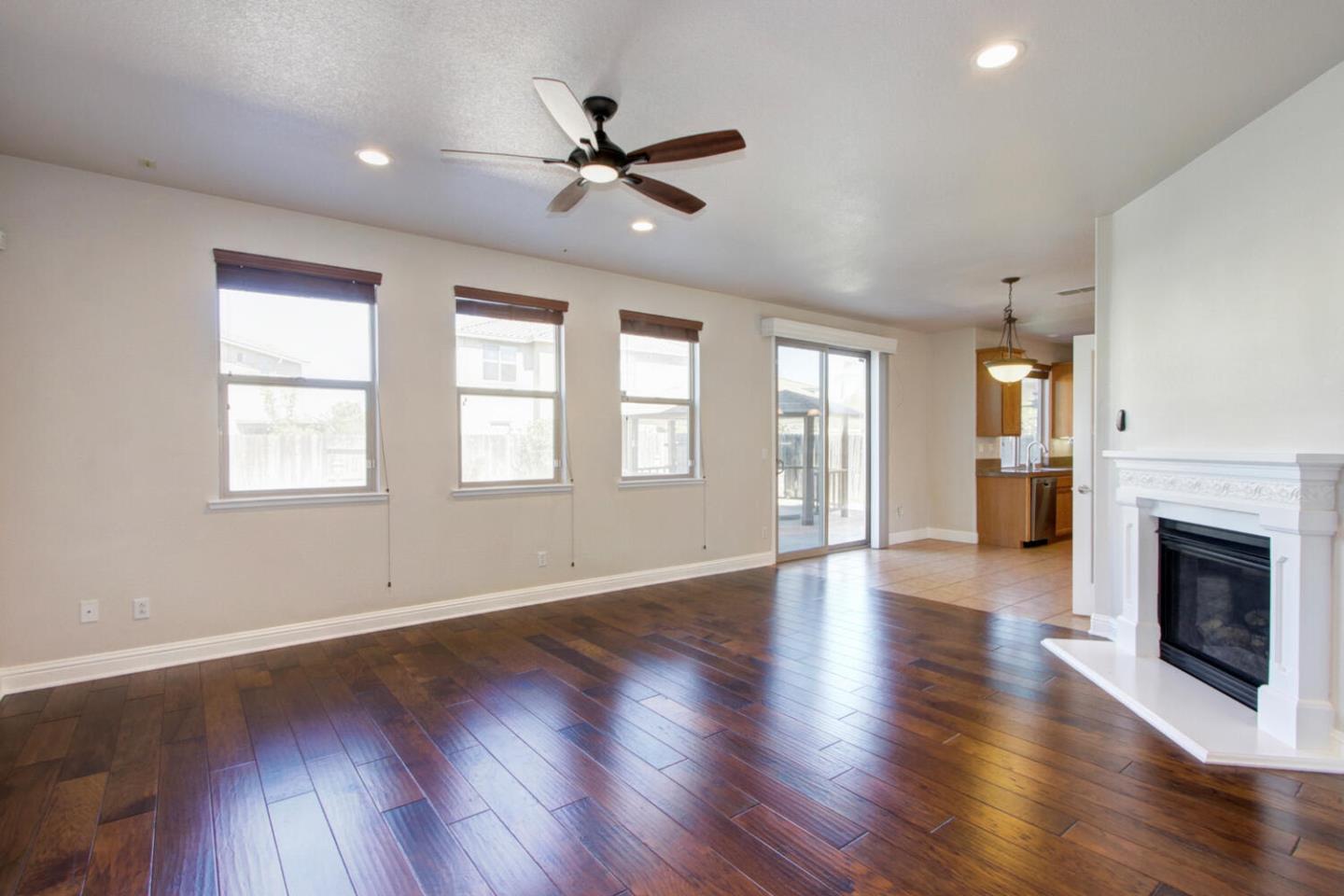 9987 Spring View Way Elk Grove, CA 95757 - Photo 10 of 28 a view of an empty room with wooden floor and a window